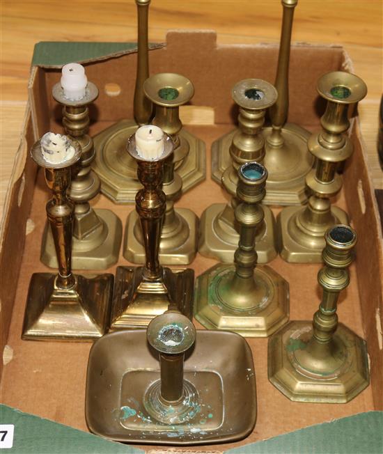 Ten brass candlesticks and a chamberstick, 18th/19th century tallest 54cm